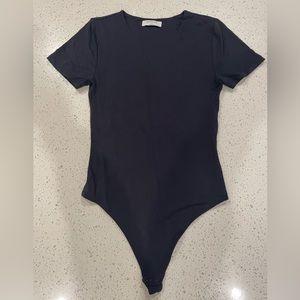 Babaton short sleeve black body suit.